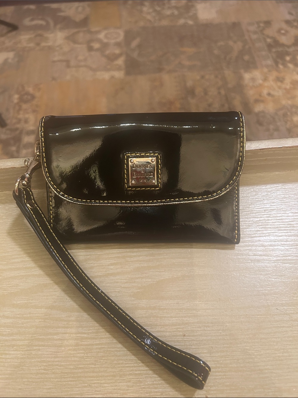 Dooney & Bourke Black Patent Leather Wristlet Clutch with Gold Logo